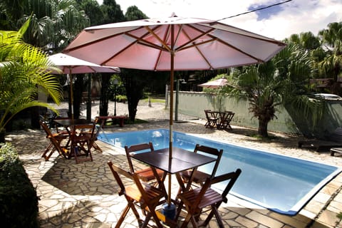 Outdoor pool, open 8:00 AM to 8:00 PM, pool umbrellas, sun loungers