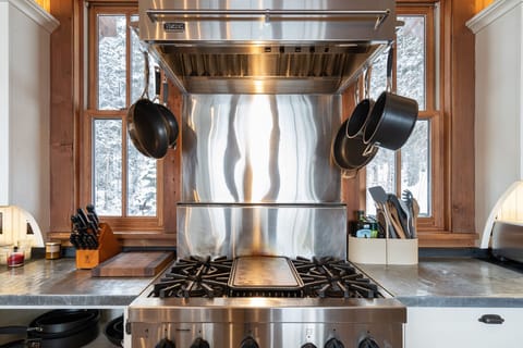 A Chefs dream of a Kitchen fully stocked with all your kitchen needs. Stainless Steel 4 burner and griddle gas stove.