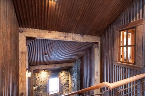 The mix of Industrial decor and log cabin feel creates the perfect ambiance for this stunning modern chalet.