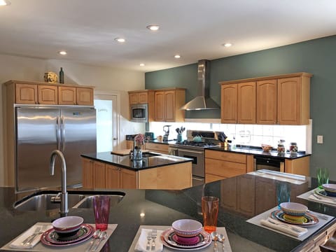 Kitchen is a dream for home cooks preparing for large gatherings. Extra-Large capacity refrigerator and freezer, separate wine refrig, 2 sinks.
