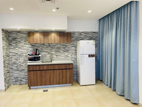 Standard Apartment, 1 Bedroom | Private kitchen | Full-size fridge, microwave, coffee/tea maker, paper towels