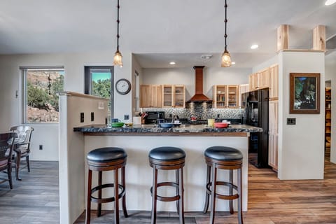 Stone Counters and Island with Bar Seating