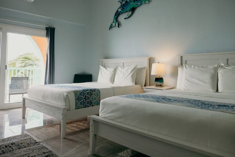 Deluxe Double Room, 2 Queen Beds, Ocean View, Beachfront | Premium bedding, memory foam beds, individually decorated