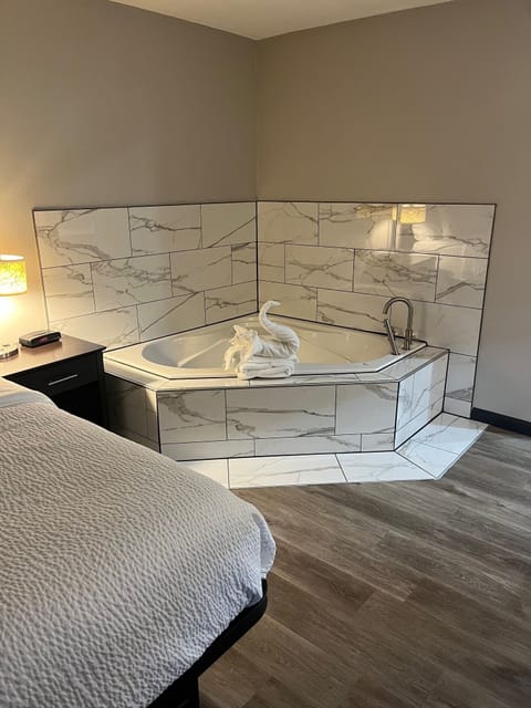 Suite, 1 King Bed, Non Smoking, Jetted Tub | Premium bedding, desk, blackout drapes, iron/ironing board