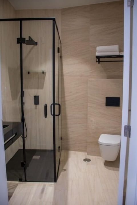 Deluxe Room, 1 King Bed, Accessible | Bathroom | Shower, hydromassage showerhead, designer toiletries, hair dryer