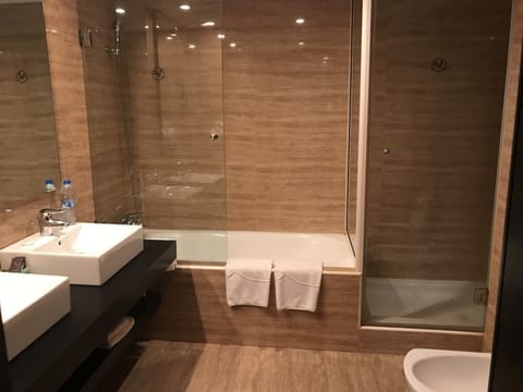 Premium Suite | Bathroom | Separate tub and shower, rainfall showerhead, hair dryer, slippers