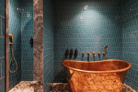 Luxury Penthouse | Bathroom | Rainfall showerhead, hair dryer, slippers, towels