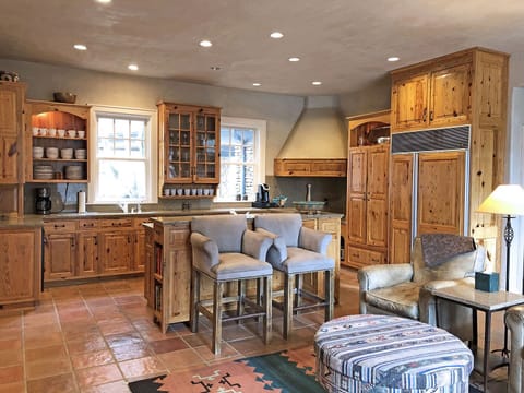 The Entry Foyer opens to Kitchen, Dining and Conversation Areas. There is also a Half Bath off the Entry Foyer to serve the Main Level.