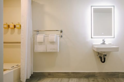 Designer toiletries, hair dryer, towels