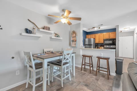 Key to pool area and pool bracelets stored in row boat on dining room wall .