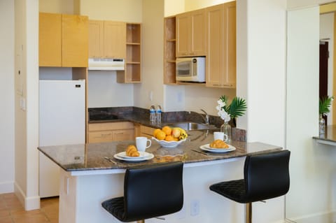 Executive Suite | Private kitchen | Full-size fridge, microwave, stovetop, coffee/tea maker