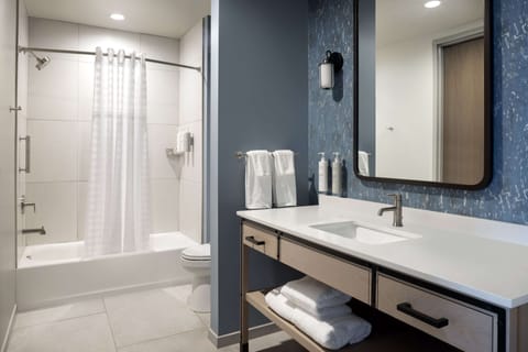 Suite, 2 Queen Beds (2 Room) | Bathroom | Hair dryer, towels, soap, shampoo