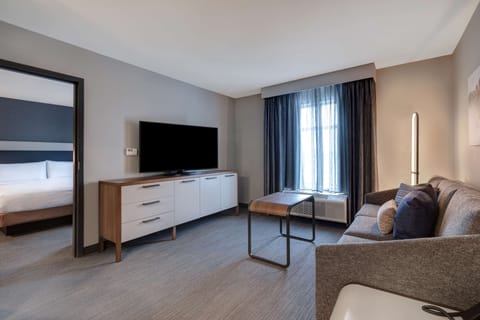 Suite, 1 Bedroom | Living area | 50-inch Smart TV with cable channels, TV