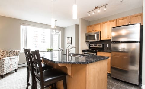 Suite, 1 Bedroom | Private kitchen | Full-size fridge, microwave, stovetop, dishwasher