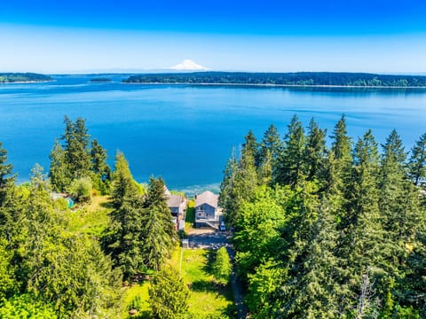 Wake up to a stunning view of the water and Mt Rainier in this spacious 4-bedroom, 3-bathroom family home in Longbranch