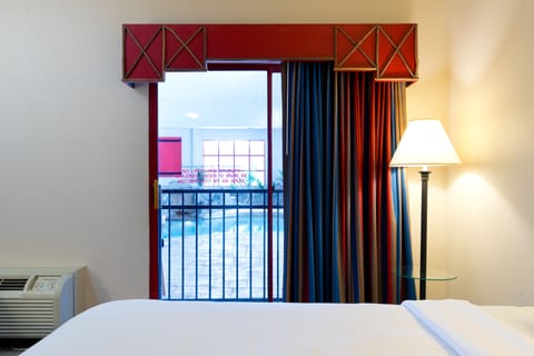 Room, 2 Queen Beds, Poolside | Blackout drapes, iron/ironing board, free WiFi, bed sheets