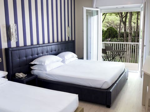 Deluxe Triple Room (beach access included) | Minibar, in-room safe, desk, free WiFi