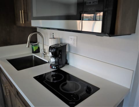 Fridge, microwave, stovetop, coffee/tea maker