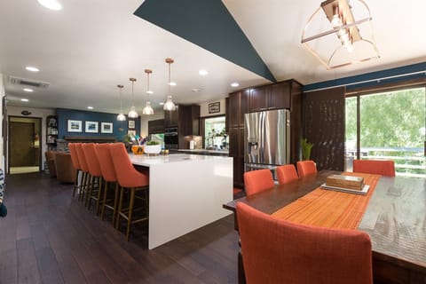 Kitchen with waterfall island and dining area