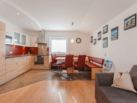 Property, Furniture, Cabinetry, Picture Frame, Couch, Wood, Countertop, Lighting, Orange, Flooring