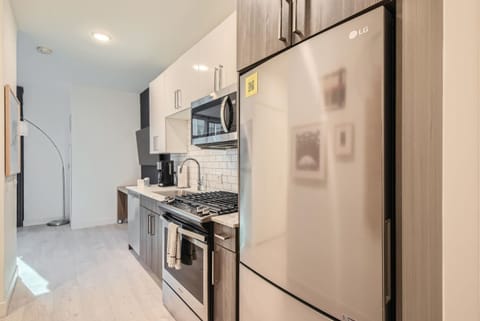 Studio, 1 Queen Bed (Studio Apartment) | Private kitchen | Oven, stovetop, dishwasher, coffee/tea maker