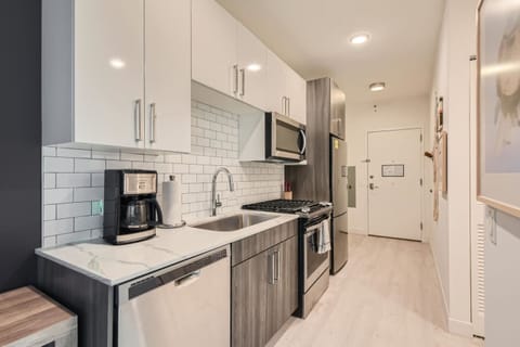 Studio, 1 Queen Bed (Studio Apartment) | Private kitchen | Oven, stovetop, dishwasher, coffee/tea maker