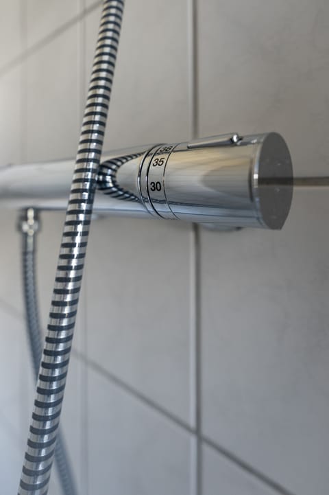 Shower, rainfall showerhead, hair dryer, heated floors