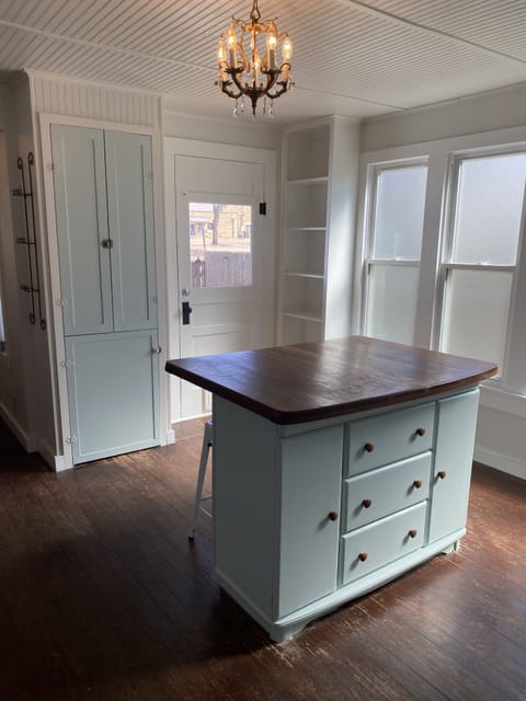 Door from kitchen to front patio dining area