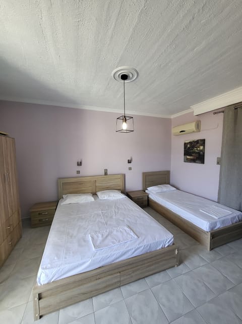 Standard Triple Room | In-room safe, iron/ironing board, free WiFi, bed sheets