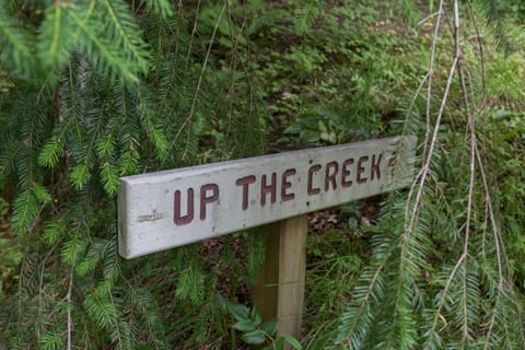 One of the many private trailhead signs on the property leading to the creek