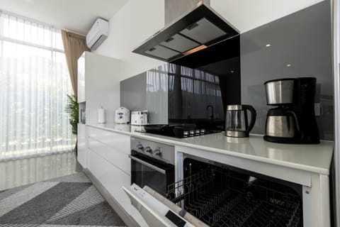 Family Villa | Private kitchen | Fridge, coffee/tea maker, electric kettle, highchair