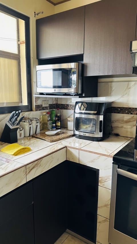 Deluxe Apartment, 2 Bedrooms, Kitchen | Private kitchen | Full-size fridge, microwave, oven, stovetop