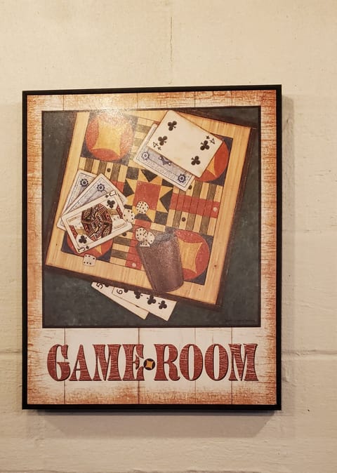 Basement game room with 3-in-1 Foosball table and basketball game