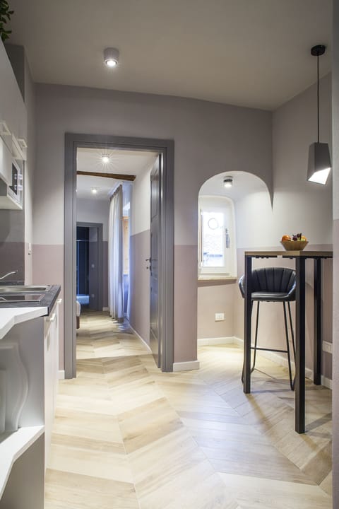 Comfort Apartment, 1 King Bed, Non Smoking, Fireplace | Private kitchen | Microwave, stovetop, dishwasher, highchair