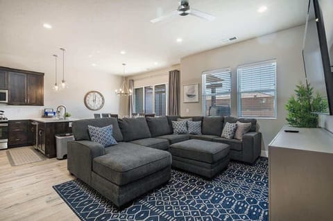 Main family room with comfortable sectional sofa and TV