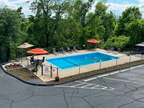 Seasonal outdoor pool, open 9:00 AM to 9:00 PM, pool umbrellas