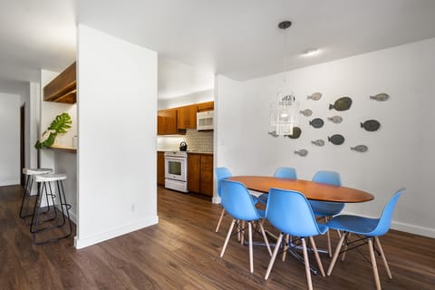 Enjoy meals together with open sightlines to the kitchen, living room, and lanai.