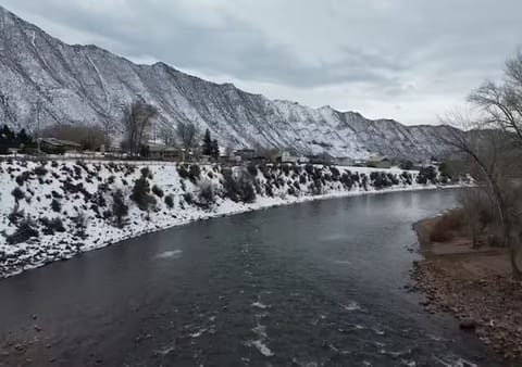 Winter view of the Colorado River framed by the snowy Grand Hogback Mountains