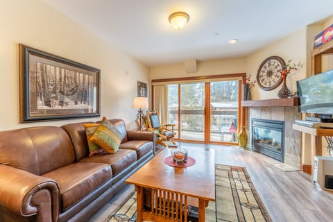 Sink into rich leather seating by your cozy fireplace, where rustic charm meets modern comfort in your mountain retreat.