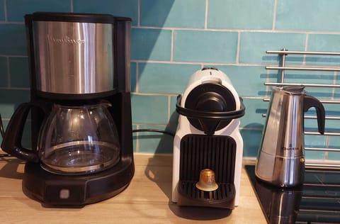 An electric kettle & a selection of coffee makers are provided