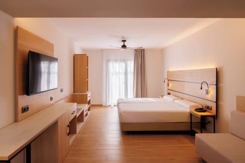 Junior Suite, Pool View | Minibar, in-room safe, desk, free WiFi