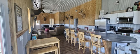 8 bar stools and small dining table that could hold up to 6 pl