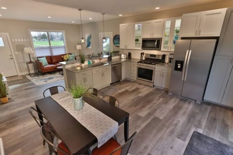 Main floor kitchen with stainless steel stove, oven, and microwave
