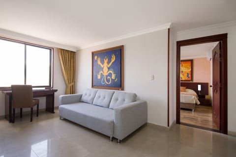 Standard Quadruple Room | Living area | Flat-screen TV