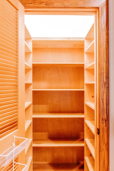 Large walk in pantry next to the kitchen.