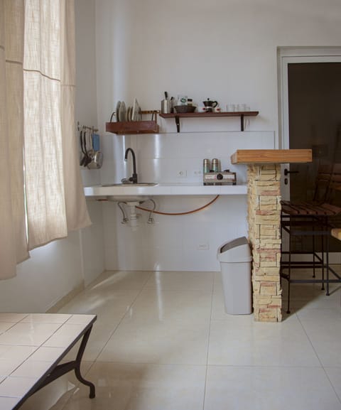 Comfort Apartment | Private kitchen | Fridge, dining tables