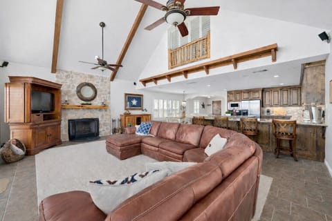 Kick back in the living room with great views and an updated larger TV (see in other photos) at Lakeshore Haven on Lake Travis in Spicewood, TX—easy comfort for families and groups.