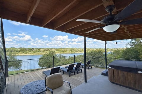Unwind after lake days in the hot tub and loungers with sweeping Lake Travis views in Spicewood, TX—your great experience starts here.