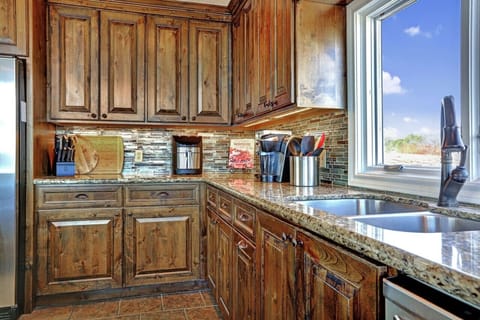 Cook with ease in the fully stocked kitchen at Lakeshore Haven on Lake Travis—everything you want and more for a great experience in Spicewood, TX.