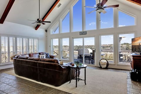 Beautiful cathedral ceilings open up the expansive views of the lake, nature, and gorgeous Texas skies!